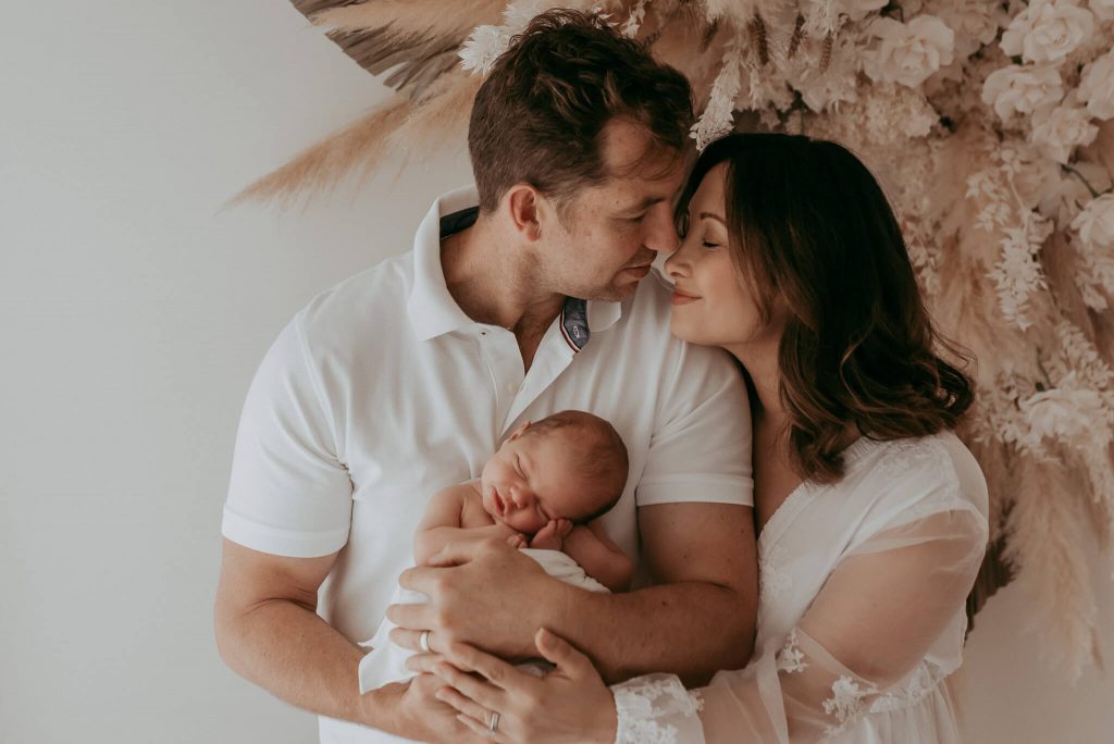 family and newborn photographed together